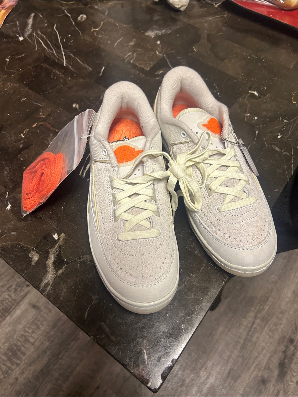 Jordan Low-Top Sneakers in Light Gray with Orange Accents